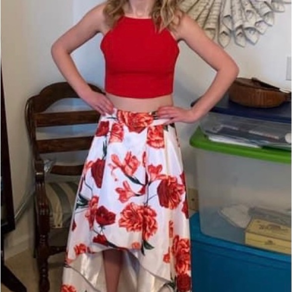 2 piece red floral dress. The bottom is high low. It’s a size 7